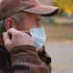 Close Up Portrait Elderly Man Puts a Medical Mask on His Face - VideoHive Item for Sale