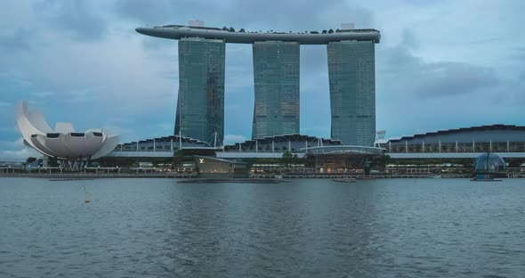 Marina Bay sands of Singapore viewed from across the lake with water reflection and Artscience museu