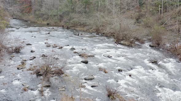 Drone shot of river low altitude flying upstream in late fall in western North Carolina.