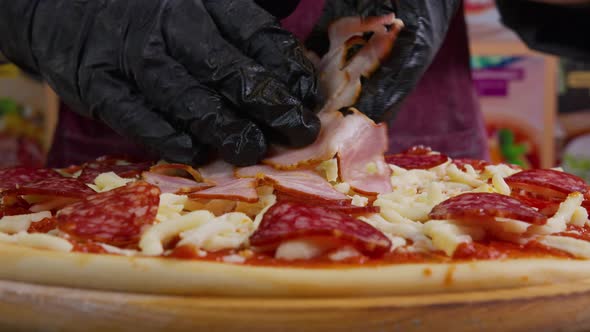 Close Up View of a Man Chef Cooking Italian Pizza. The Process of Making Pizza at Table . Fresh