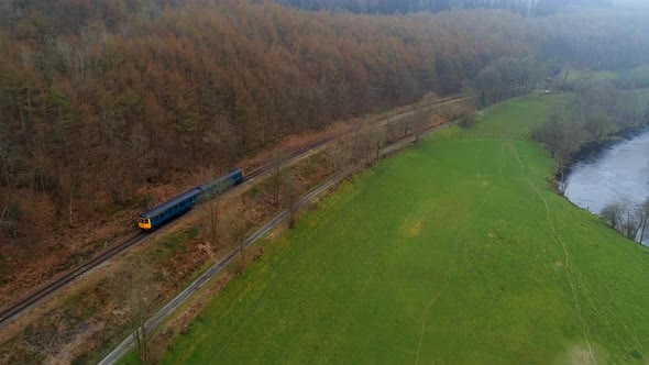 Commuter Train in the Early Morning Mist