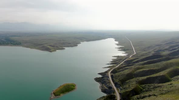 Aerial view of a reservoir with fresh water with the mountain