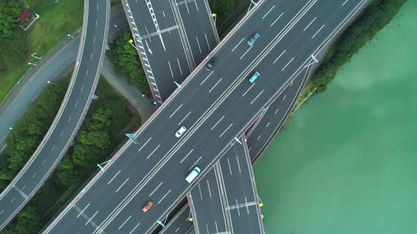 Aerial Drone Top Down View of Highway Multilevel Junction Road with Moving Cars at Daytime