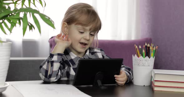 Girl Learning Online Lessons Using Digital Tablet Computer, Distance Education