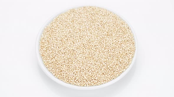 quinoa seeds on white background, rotating