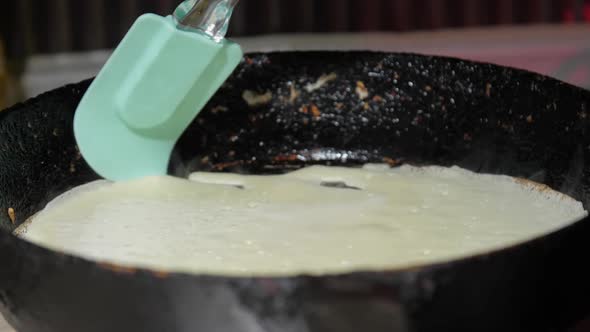 Manicured Lady Cook Hand Turns Hot Pancake on Frying Pan