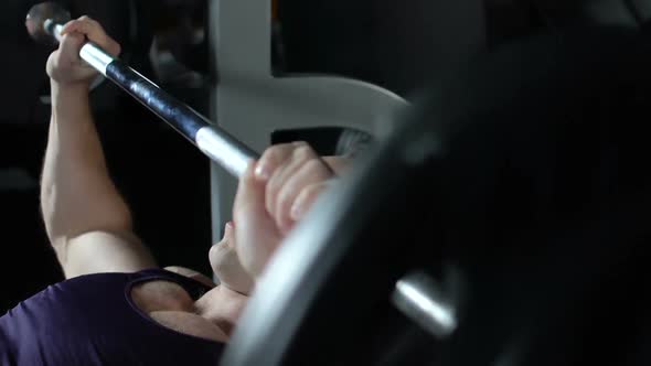 Handsome Muscular Man Lifting Barbell in Gym to Gain Strength, Sport Motivation