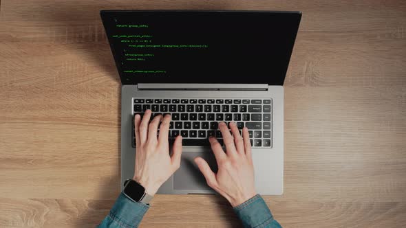 Timelapse of Man Hands are Typing Commands of a Laptop Keyboard