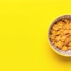 Corn Cereals in Bowl. Yellow Background with Copy Space. Stop Motion. - VideoHive Item for Sale