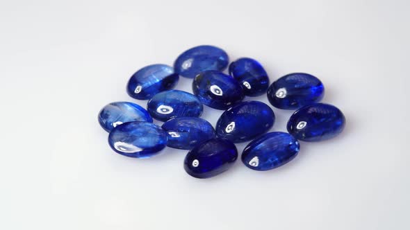 Natural Kyanite Gemstone on the White Background on the Turning Table