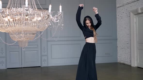 Mysterious Woman Dressed in Black is Dancing in Hall Magical and Fabulous Image