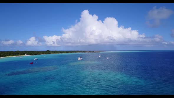 Aerial top view scenery of tranquil sea view beach break by clear water and bright sand background o