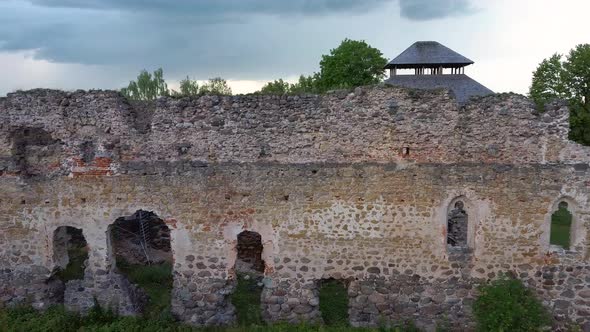 Medieval Castle Ruins in Latvia Rauna. Aerial View Over Old Stoune Brick Wall of Raunas Castle 