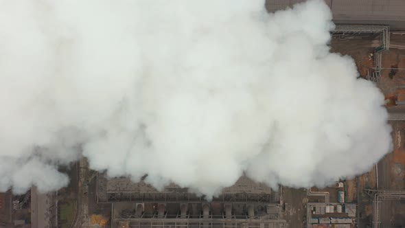 Aerial View. Emission To Atmosphere From Industrial Pipes. Smokestack Pipes Shooted with Drone