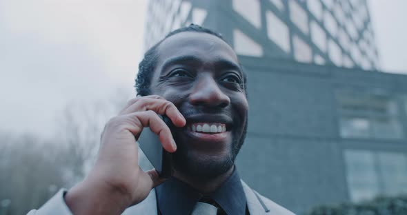 Young african businessman speaking on the phone