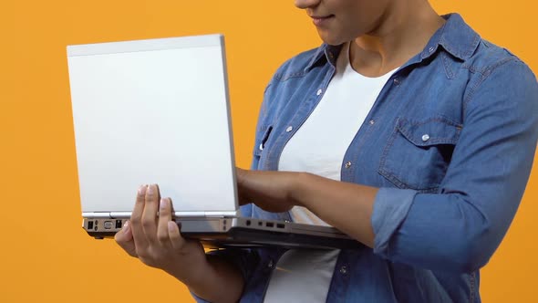 Young Female Typing Message on Laptop and Showing Ok Sign, Online Application