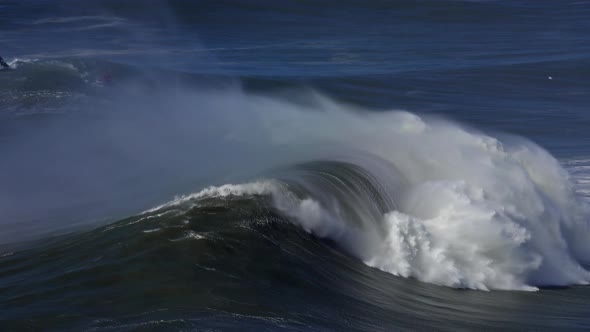 Large Wave Rolling on Surface of Stormy Ocean