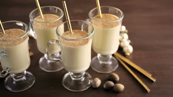 Traditional holiday drink egg nog garnished with nutmeg.