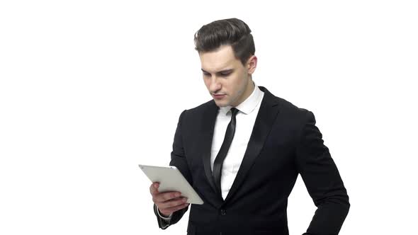 Young Businessman Working on Tablet Computer Isolated on White Background