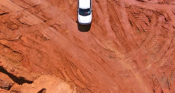 Digger on Earthworks in Excavator Dig the Trenche at Construction Site on Arial View of Earth Moving