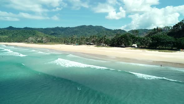 Aerial Drone View of Tropical Paradise Beach with White Sand and Turquoise Crystal Clear Sea Water