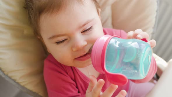 Funny Baby Drinking Bottled Water