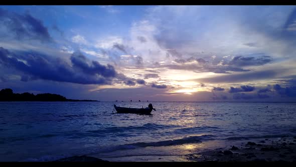 Aerial scenery of idyllic coast beach journey by shallow lagoon and white sand background of a picni