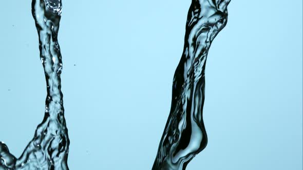 Water pouring and splashing in ultra slow motion 1500fps on a reflective surface - WATER POURS 