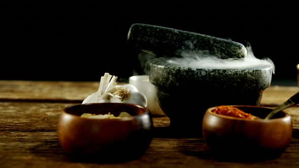 Various type of spices in bowl with mortar and pestle 4k