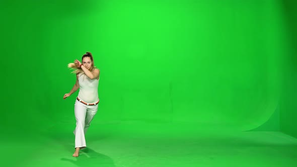 Woman with Long Hair Practicing Capoeira on Chroma Key.