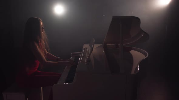 Footage Of Female Pianist Plays In Beautiful Grand Piano On Stage In Concert