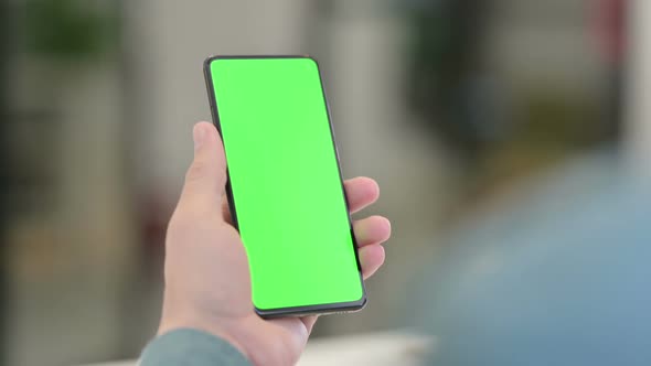 Middle Aged Man using Smartphone with Chroma Screen