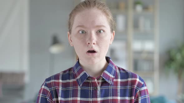 Close Up of Young Woman Showing Expression of Shock