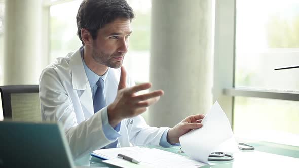 Doctor explaining results to out-of-frame patient