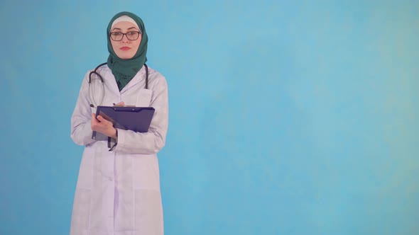 Portrait of a Young Muslim Doctor Looking at the Camera