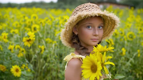 Girl Holding Bouquet of Sunflowers and Rotating on Field