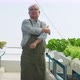old asian man elder farmer feel exhausted and muscle pain from working hard in green house - VideoHive Item for Sale