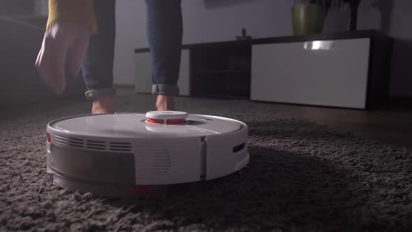 Female Hand Taking Out Dust Container From Cleaner