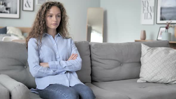 Curly Hair Woman Coming and Sitting on Sofa