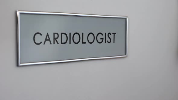 Cardiologist Room Door in Hospital, Patient Hand Knocking Closeup, Heart Disease