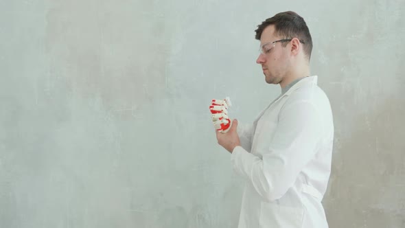 Scientist Engineer Conducts Tests of Robotic Prosthetic Hand Trying To Move Fingers, Making Gestures