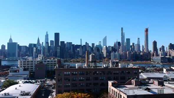 Waterfront High-rise Buildings In Hunter's Point Across East River With Blue Sky In Background In Lo