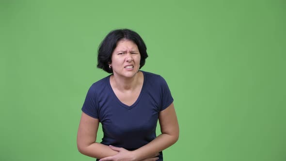 Stressed Woman with Short Hair Having Stomach Ache