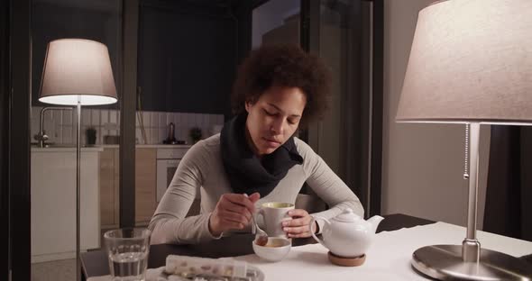 Ill Female Drinking Tea with Honey