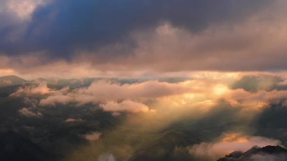 Low Clouds Over a Highland Plateau in the Rays of Sunset