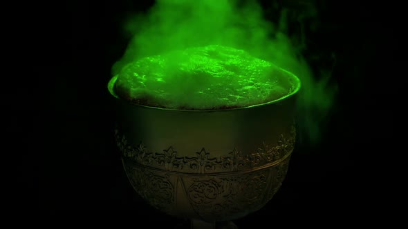 Green Bubbling Potion In Gold Cup