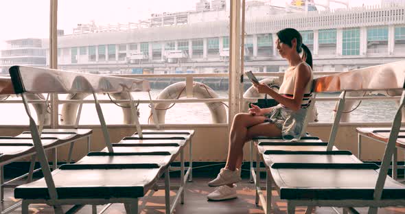 Woman Taking Ferry in Hong Kong Under Sunset Time 