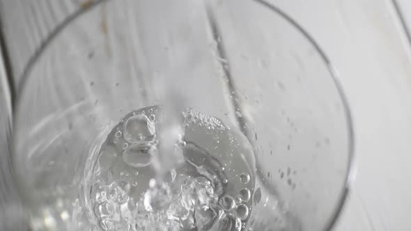 Closeup of Water Pouring Into a Transparent Glass