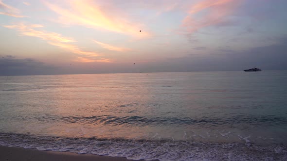 Cloudscape Sundown in Late Evening with Birds and Ship Over Sea Sundown