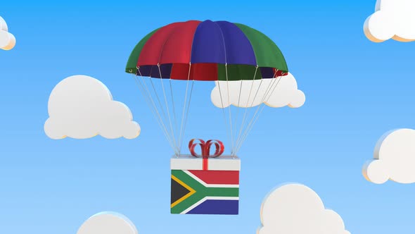 Carton with Flag of South Africa Falls with a Parachute